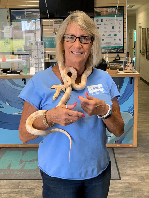 Debbie poses with Eco the corn snake