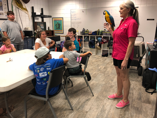 Gina and Buffy the macaw visit MDC